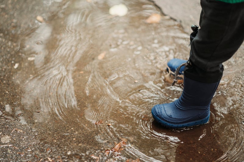 boy-feet-in-rubber-boots-while-playing-outside-on-2023-11-27-05-02-24-utc-2048x1363