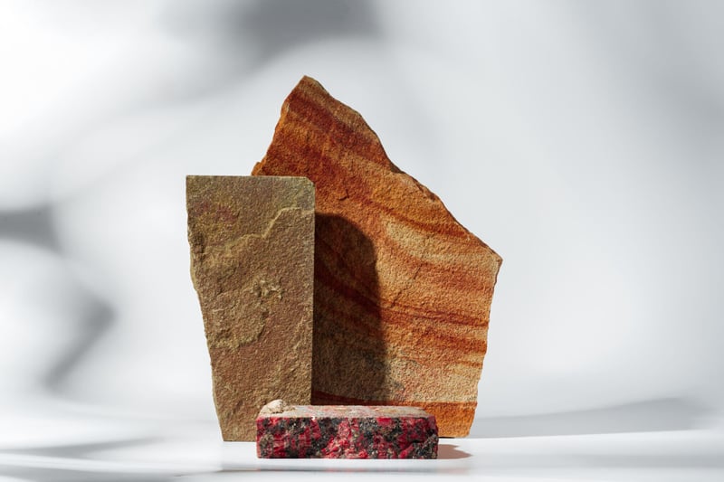 piece-of-granite-stone-on-white-background-with-sh-2023-12-14-23-13-13-utc-2048x1365