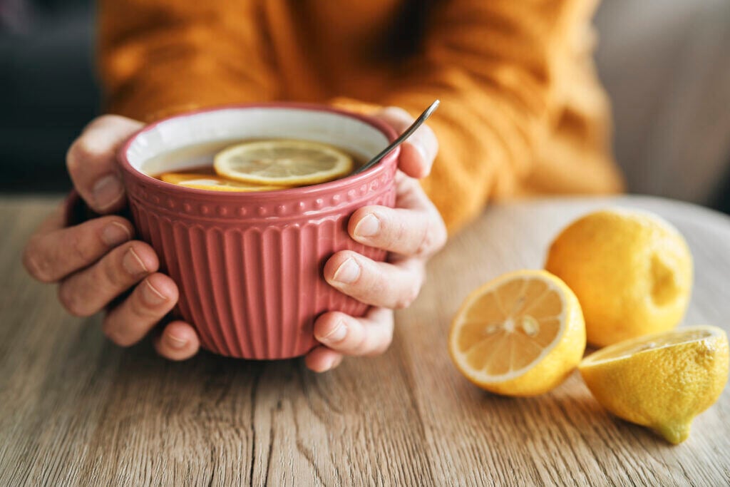 hands-holding-a-big-cup-of-hot-tea-with-lemon-2022-01-19-00-09-37-utc-1024x683
