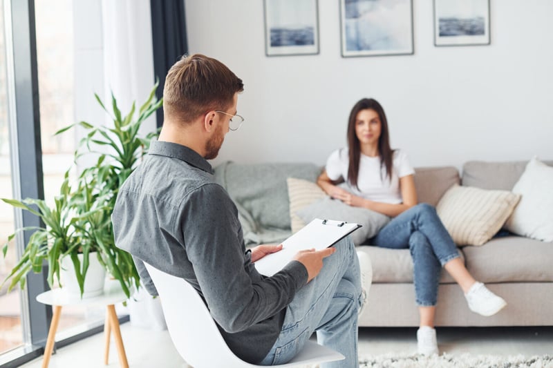young-woman-at-a-reception-at-a-psychologist-sits-2022-01-18-23-40-17-utc-1536x1024