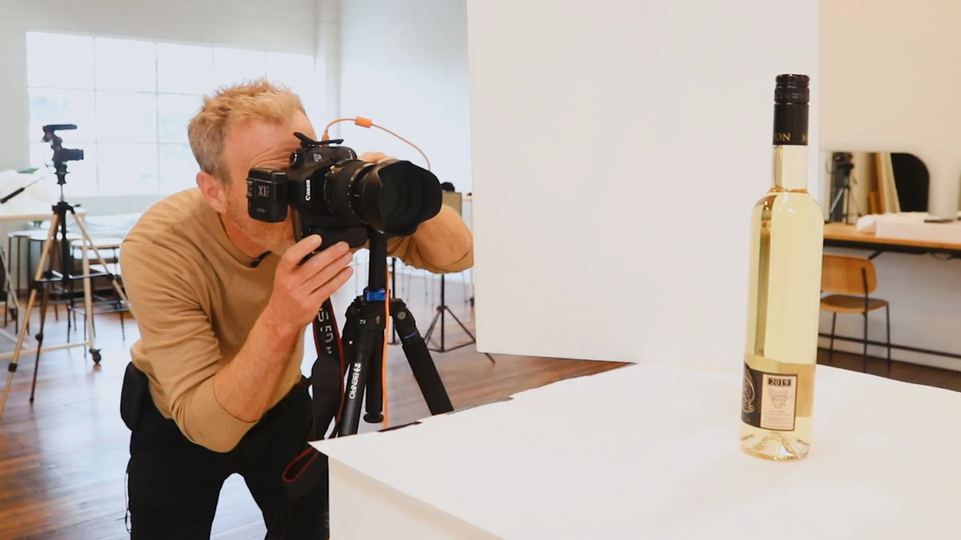 A photographer composing a studio photograph